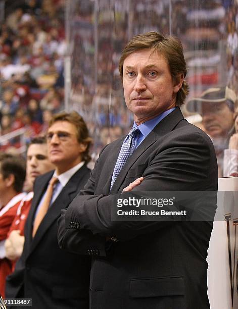 Head Coach Wayne Gretzky of the Phoenix Coyotes manages his team from behind the bench during his game against the St. Louis Blues on February 28,...