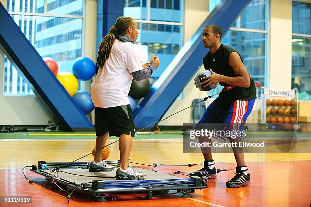 Arron Afflalo of the Denver Nuggets works out with strength and condioning coach Steve Hess on September 24, 2009 at Forza in Denver, Colorado. NOTE...