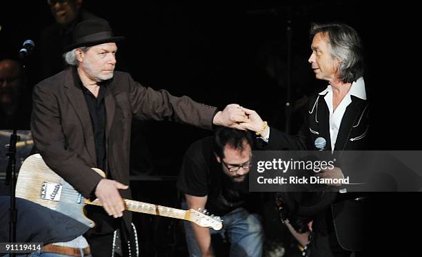 Buddy Miller and Jim Lauderdale dance to a show tune at the 8th annual Americana Honors and Awards at the Ryman Auditorium on September 17, 2009 in...