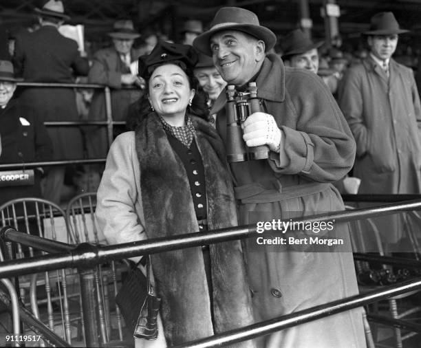 Singer and actor Al Jolson and Yiddish star Molly Picon at Belmont Park Race Track in New York , 1940.