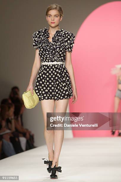 Model walks down the runway during the Moschino Cheap & Chic Fashion Show as part of the Milan Womenswear Fashion Week Spring/Summer 2010 at the...