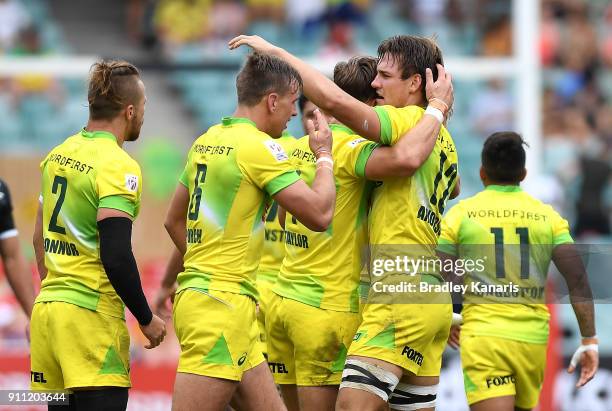 Australia celebrate victory in the quarter final match against New Zealand during day three of the 2018 Sydney Sevens at Allianz Stadium on January...