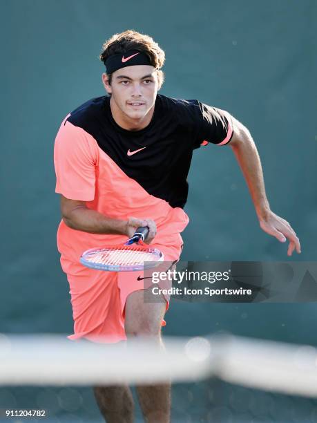 Taylor Fritz charges the net during a semifinal match against Reilly Opelka during the Oracle Challenger Series played at the Newport Beach Tennis...