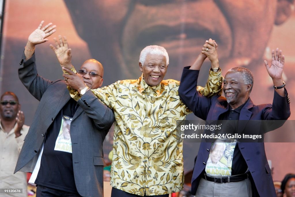 South Africa. Gauteng. Former South African president and freedom fighter Nelson Mandela celebrates his 90th birthday with president Thabo Mbeki and ANC president Jacob Zuma at Loftus Stadium.