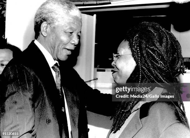 Former President Nelson Mandela with actress Whoopi Goldberg.