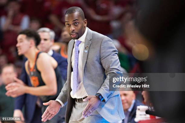 Head Coach Mike Boynton Jr. Of the Oklahoma State Cowboys directs his team during a game against the Arkansas Razorbacks at Bud Walton Arena on...