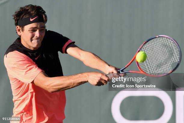 Taylor Fritz hits a backhand shot during a semifinal match against Reilly Opelka during the Oracle Challenger Series played at the Newport Beach...