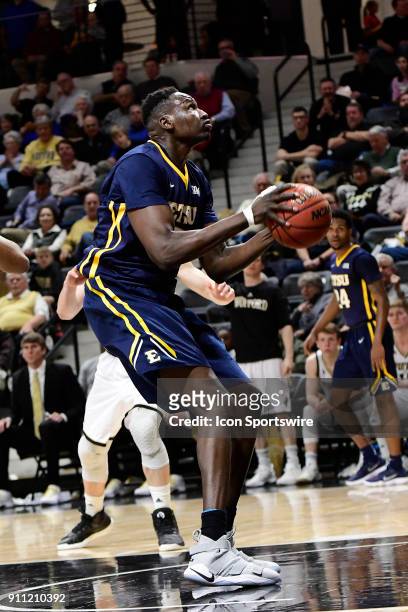 Peter Jurkin center East Tennessee State University Buccanneers stands in the cylinder to shoot for two against the Wofford College Terriers,...