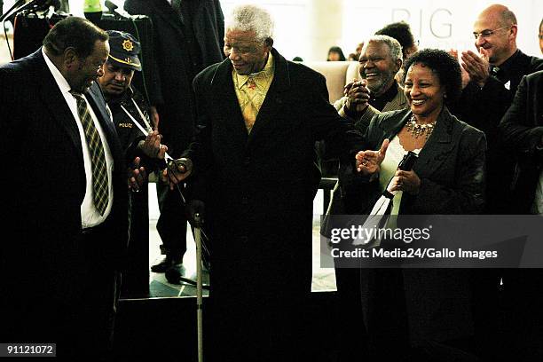 The opening of the Maponya Mall in Soweto. Nelson Mandela cuts the ribbon to officially open the mall.