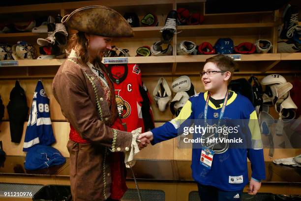 Erik Karlsson of the Ottawa Senators meets Make-A-Wish kid, Steven Koutrouliotis in the locker room before 2018 GEICO NHL All-Star Skills Competition...