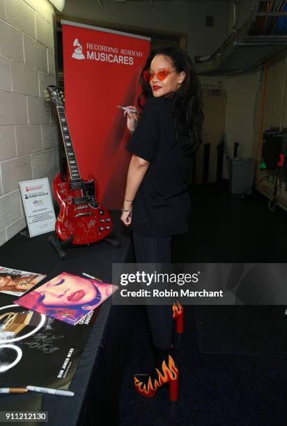 Singer Rihanna poses with the GRAMMY Charities Signings during the 60th Annual GRAMMY Awards at Madison Square Garden on January 27, 2018 in New York...