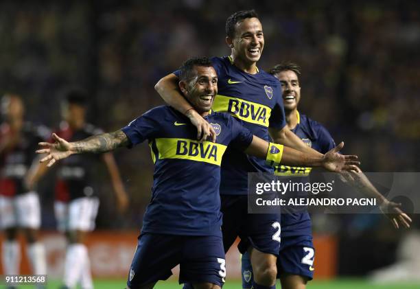 Boca Juniors' forward Carlos Tevez , midfielder Gonzalo Maroni and defender Julio Buffarini celebrate after Uruguayan midfielder Nahitan Nandez...