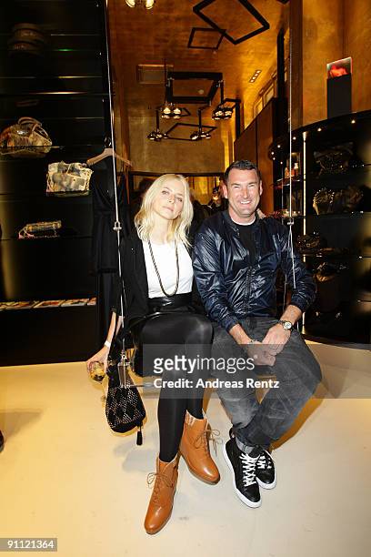 Model Eva Padberg and fashion designer Michael Michalsky take a seat on a swing at the opening of Michalsky Gallery on September 24, 2009 in Berlin,...