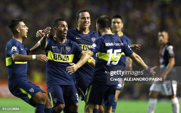 Uruguayan midfielder Nahitan Nandez celebrates with forward Carlos Tevez , midfielder Gonzalo Maroni and forward Cristian Pavon after score the...