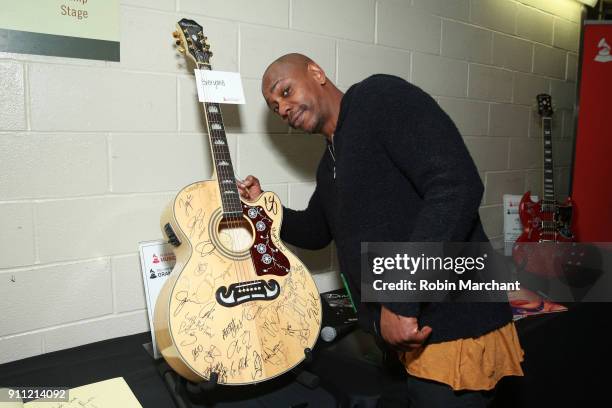 Comedian Dave Chappelle poses with the GRAMMY Charities Signings during the 60th Annual GRAMMY Awards at Madison Square Garden on January 27, 2018 in...