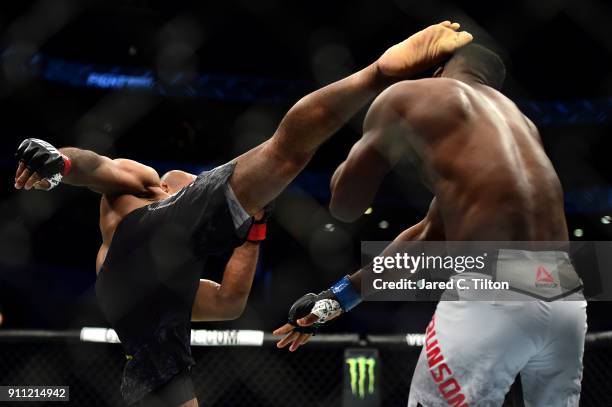 Ronaldo "Jacare" Souza of Brazil knocks down Derek Brunson in their middleweight bout during the UFC Fight Night event inside the Spectrum Center on...