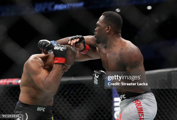 Derek Brunson punches Ronaldo "Jacare" Souza of Brazil in their middleweight bout during UFC Fight Night at Spectrum Center on January 27, 2018 in...