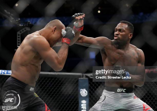 Derek Brunson punches Ronaldo "Jacare" Souza of Brazil in their middleweight bout during UFC Fight Night at Spectrum Center on January 27, 2018 in...