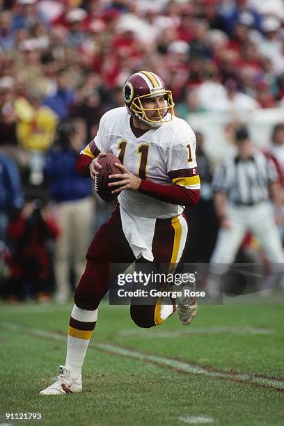 Quarterback Mark Rypien of the Washington Redskins drops back to pass during the 1990 NFC Divisional Playoffs against the San Francisco 49ers at...