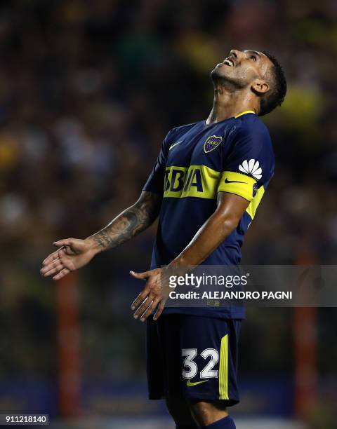Boca Juniors' forward Carlos Tevez reacts after missing a chance of goal against Colon during their Argentina First Division Superliga football match...