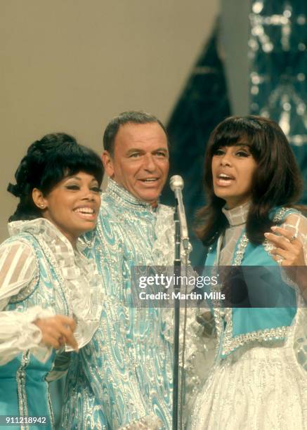 Singer and actor Frank Sinatra and The 5th Dimension's Florence LaRue and Marilyn McCoo sing on stage during the television special 'Francis Albert...