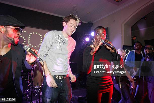 Singer Estelle performs onstage with a fan for the Arthurs Day Guinness 250th Anniversary Celebration held at the Odeon on September 24, 2009 in...