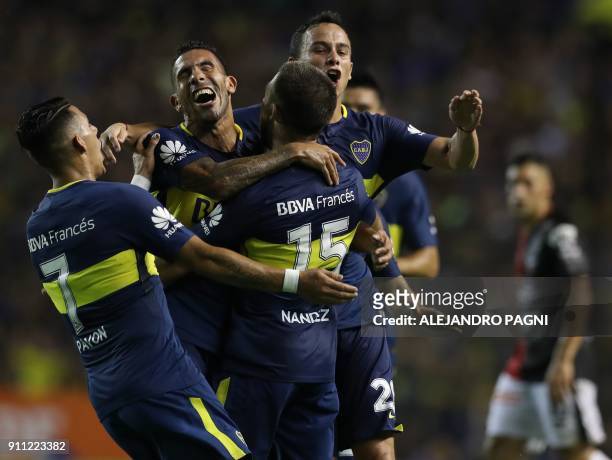 Uruguayan midfielder Nahitan Nandez celebrates with forward Carlos Tevez , midfielder Gonzalo Maroni and forward Cristian Pavon after scoring the...