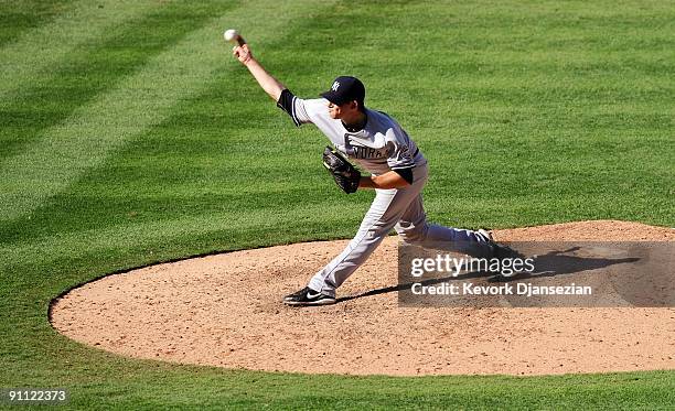 Pitcher Ian Kennedy of the New York Yankees throws a pitch during the eighth inning against Los Angeles Angels of Anaheim at Angel Stadium on...