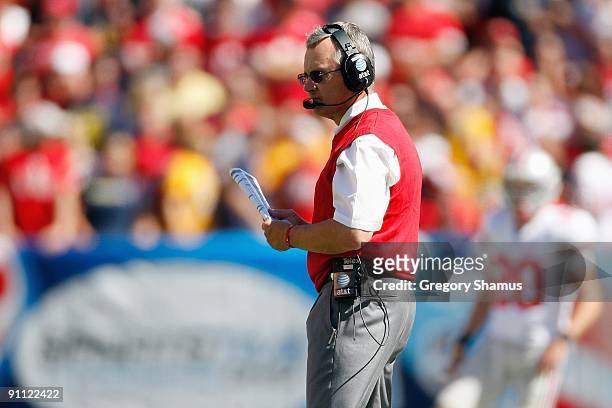 Head coach Jim Tressel of the Ohio State Buckeyes watches the action during the game against the Toledo Rockets at Cleveland Browns Stadium on...