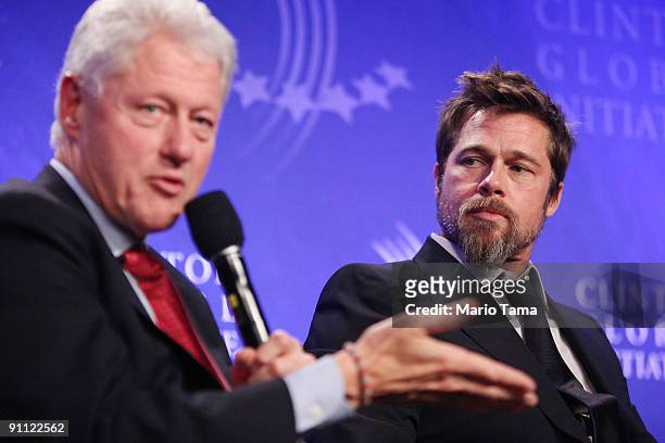 Former President Bill Clinton appears with actor Brad Pitt while discussing post-Katrina New Orleans at the Clinton Global Initiative September 24,...