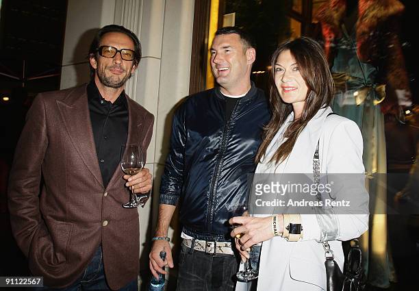 Director Oskar Roehler , his wife and fashion designer Alexandra Fischer-Roehler and fashion designer Michael Michalsky attend the opening of...