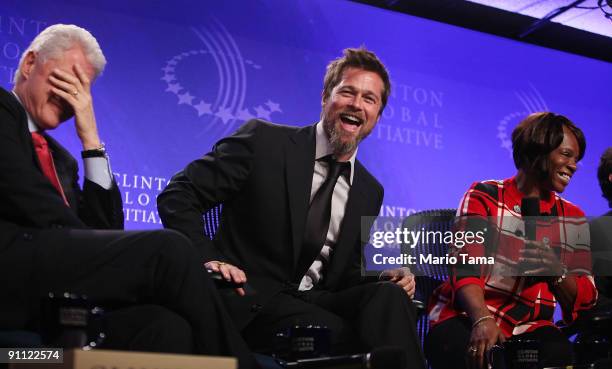 Former President Bill Clinton, actor Brad Pitt and Lower Ninth Ward homeowner Deidra Taylor laugh while discussing post-Katrina New Orleans at the...
