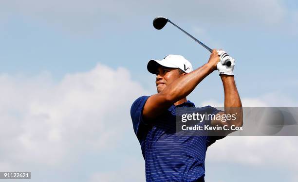 Tiger Woods tees off the seventh hole during the first round of THE TOUR Championship presented by Coca-Cola, the final event of the PGA TOUR...