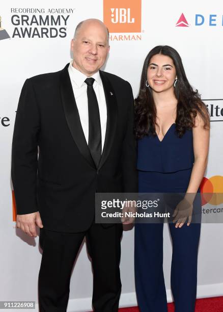 MusiCares Board of Directors member John Poppo and guest attend the Clive Davis and Recording Academy Pre-GRAMMY Gala and GRAMMY Salute to Industry...