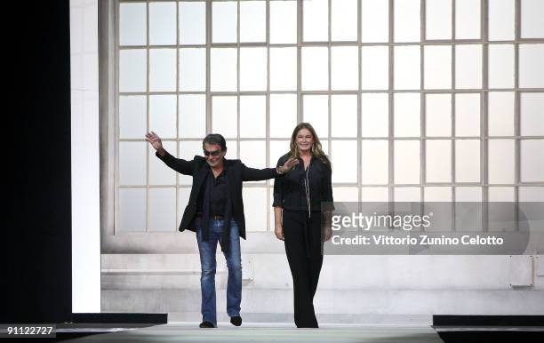 Designers Roberto and Eva Cavalli acknowledge the applause of the audience after Just Cavalli Fashion Show as part of the Milan Womenswear Fashion...