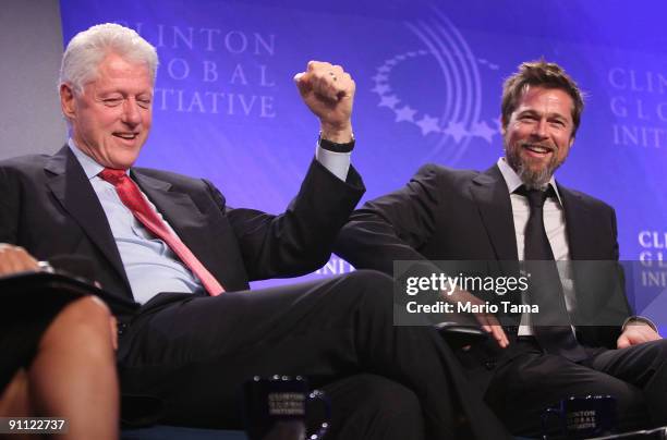 Former President Bill Clinton appears with actor Brad Pitt while discussing post-Katrina New Orleans at the Clinton Global Initiative September 24,...