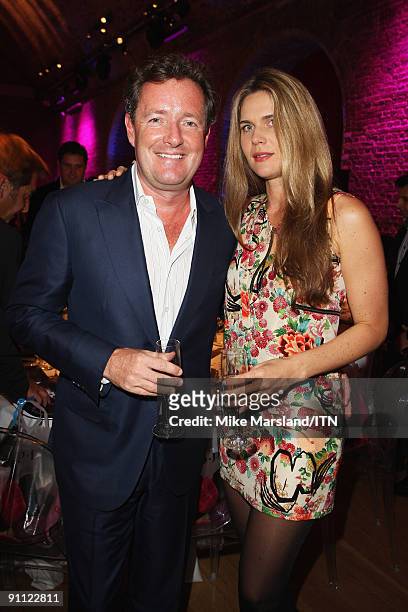 Piers Morgan and Celia Walden pose ahead of the "Newsroom's Got Talent" event held in aid of Leonard Cheshire Disability and Helen & Douglas House at...