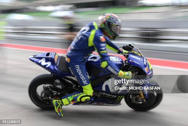 Movistar Yamaha MotoGP's Italian rider Valentino Rossi leaves the pit lane during the first day of the 2018 MotoGP pre-season test at the Sepang...