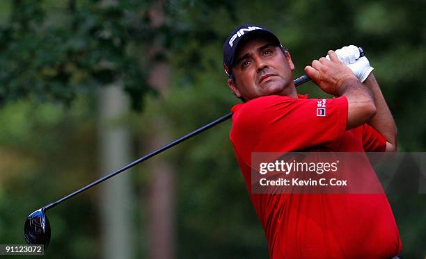 Angel Cabrera of Argentina tees off the fourth hole during the first round of THE TOUR Championship presented by Coca-Cola, the final event of the...