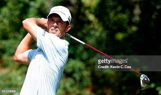 Mike Weir of Canada tees off the fourth hole during the first round of THE TOUR Championship presented by Coca-Cola, the final event of the PGA TOUR...