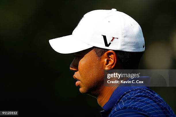 Tiger Woods awaits his putt on the 11th green during the first round of THE TOUR Championship presented by Coca-Cola, the final event of the PGA TOUR...