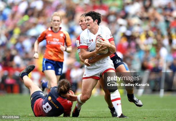 Brittany Benn of Canda is tackled in the Women's Bronze Finals match against Russia during day three of the 2018 Sydney Sevens at Allianz Stadium on...