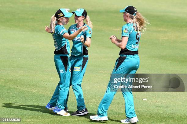 Kirby Short of the Heat celebrates with team mates after catching out Nicola Carey of the Thunder during the Women's Big Bash League match between...