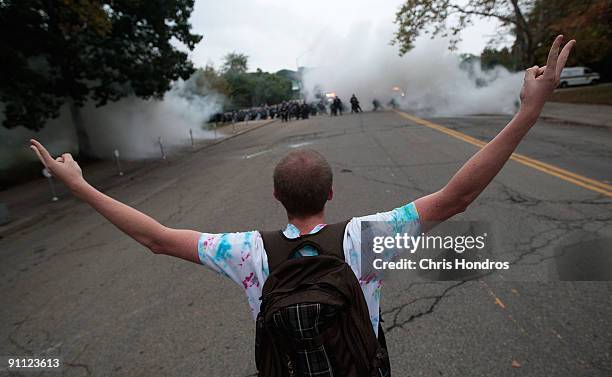Man mocks police after authorities fired tear gas on a gathering of students near Phipps Conservatory where world leaders were gathered for the G-20...