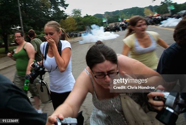 Students disperse after police fired tear gas on a gathering near Phipps Conservatory where world leaders were gathered at the University of...