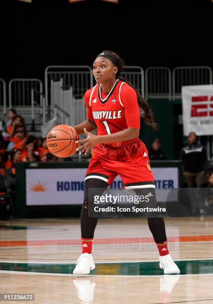 Louisville guard Dana Evans plays during a women's college basketball game between the University of Louisville Cardinals and the University of Miami...