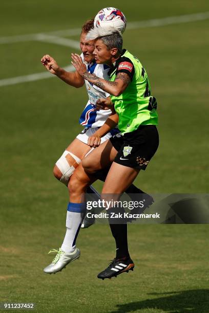Micelle Heyman of Canberra United wins a header in a contest with Natasha Prior of Newcastle during the round 13 W-League match between Canberra...