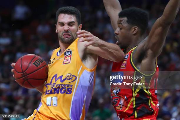 Kevin Lisch of the Kings contests the ball with Carrick Felix of Melbourne during the round 16 NBL match between the Sydney Kings and Melbourne...