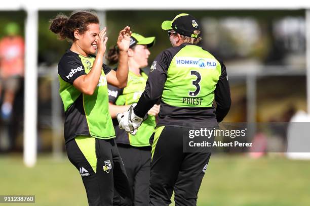 Sydney Thunder players celebrate after Kirby Short of the Heat was caught by Rachel Priest during the Women's Big Bash League match between the...