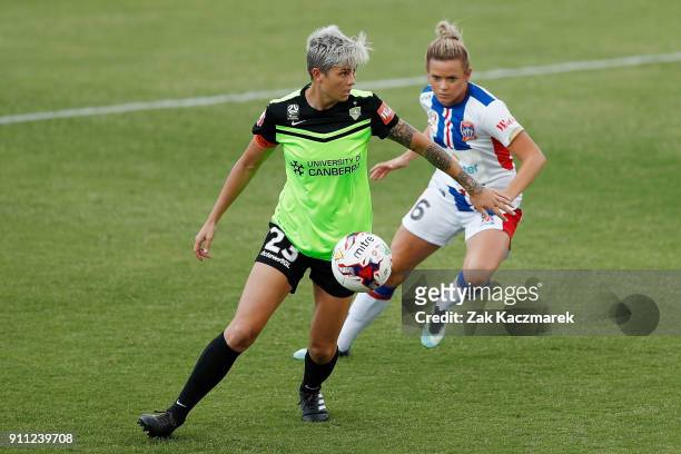 Micelle Heyman of Canberra United receives a pass as Cassidy Davis of Newcastle United looks on during the round 13 W-League match between Canberra...